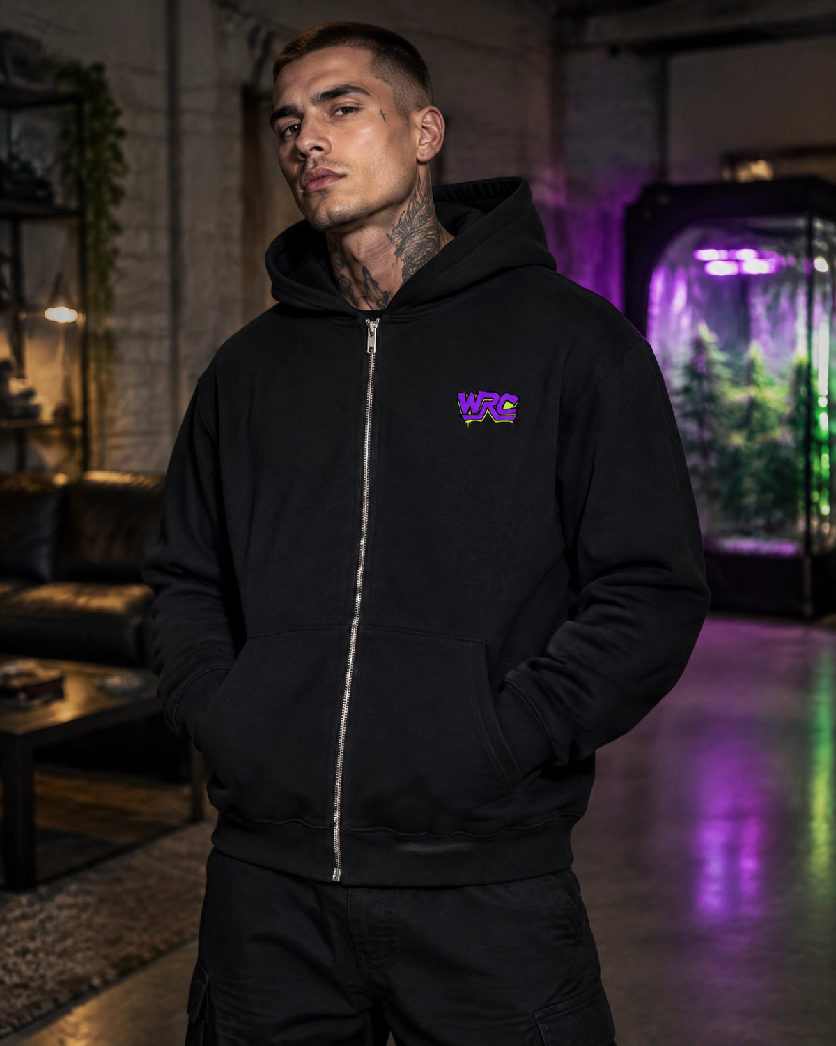 Model wearing the WRC Drip Tag men's heavy zip hoodie in black
